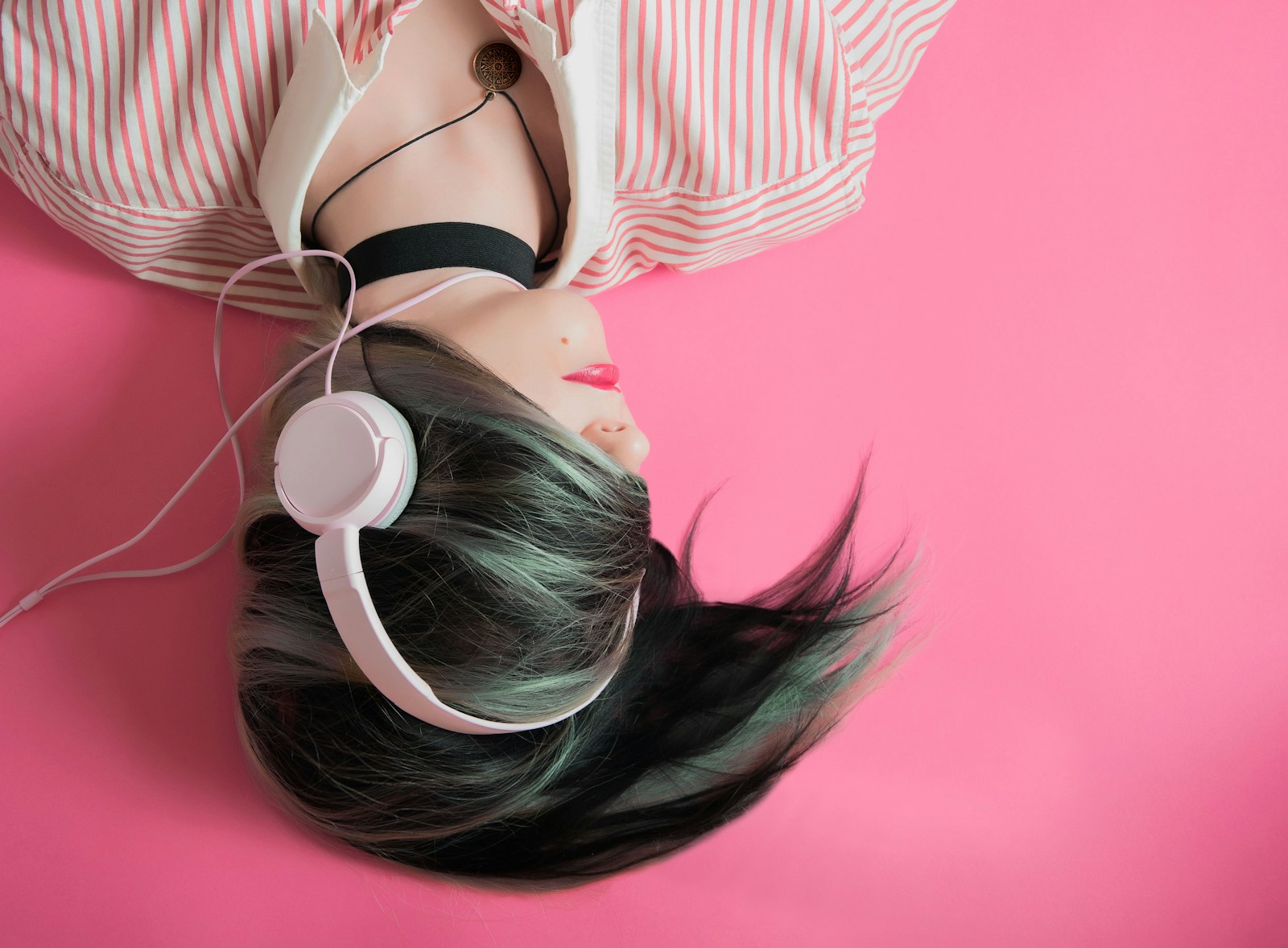 woman wearing headphones and listening song