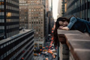 woman leaning on top building in one of the safest city